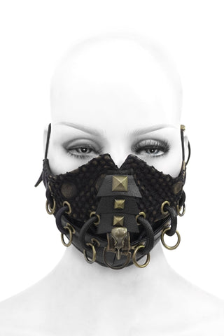 Black steampunk-style mask with gold accents on a mannequin head against a white background