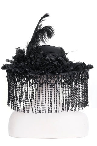 Eva Lady EAS019 black Victorian Gothic wide-brim hat with cascading beaded fringe, floral trim, and a tall black feather, displayed on a white background.