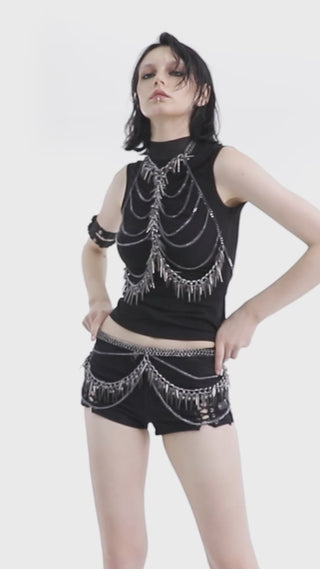 Model wearing Gothic black chain and spike harness top with matching shorts, Punk Rave WS-621, turning to showcase front and side views