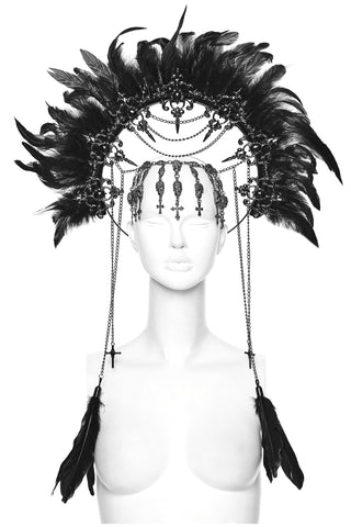 Black feathered headdress with chains and gemstone details displayed on a mannequin against a white background.