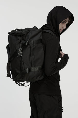 Punk Rave WS-877 black Gothic backpack worn with a black hoodie and cargo pants on a white background.