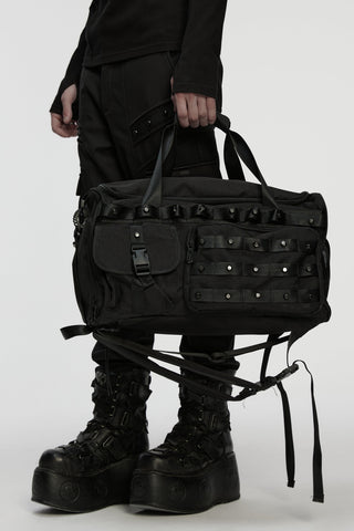 Punk Rave WS-877 black studded shoulder bag carried with Gothic clothing and platform boots on a white background.