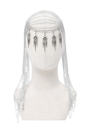 Silver Gothic headpiece on mannequin with layered chains and spiked skull pendants hanging over the forehead.