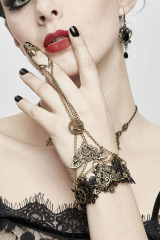 Woman wearing steampunk lace hand jewellery and black lace outfit