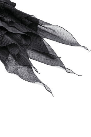 Jagged handkerchief hem of black gothic skirt with raw edge layers