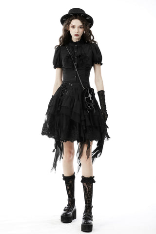 Woman wearing the Dark in Love IW087 black Gothic blouse with puff sleeves, layered lace skirt, gloves, and platform boots on white background