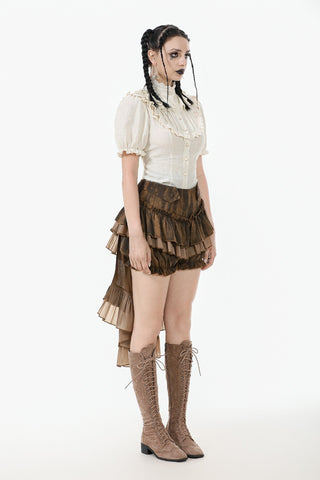 Person wearing a vintage-style outfit with a white blouse, brown ruffled skirt, and knee-high boots on a white background.