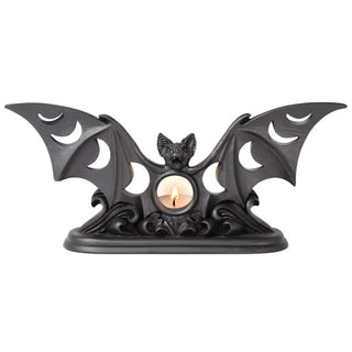 Black bat moon phase tea light holder with a lit candle in the centre