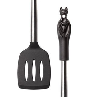 Close-up of a black bat handle and slotted spatula head with stainless steel shaft