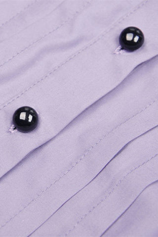 Detail shot of black dome buttons and pleated front panel on light violet Gothic shirt
