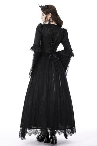 Model turned showing back profile of Gothic lace dress with long sleeves