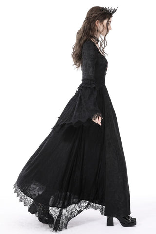 Side view of model walking in black Gothic vampire dress showing movement and flowing lace skirt
