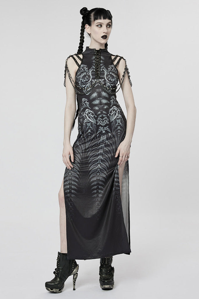 Woman wearing long black cyberpunk dress with alien-style pattern and side slits