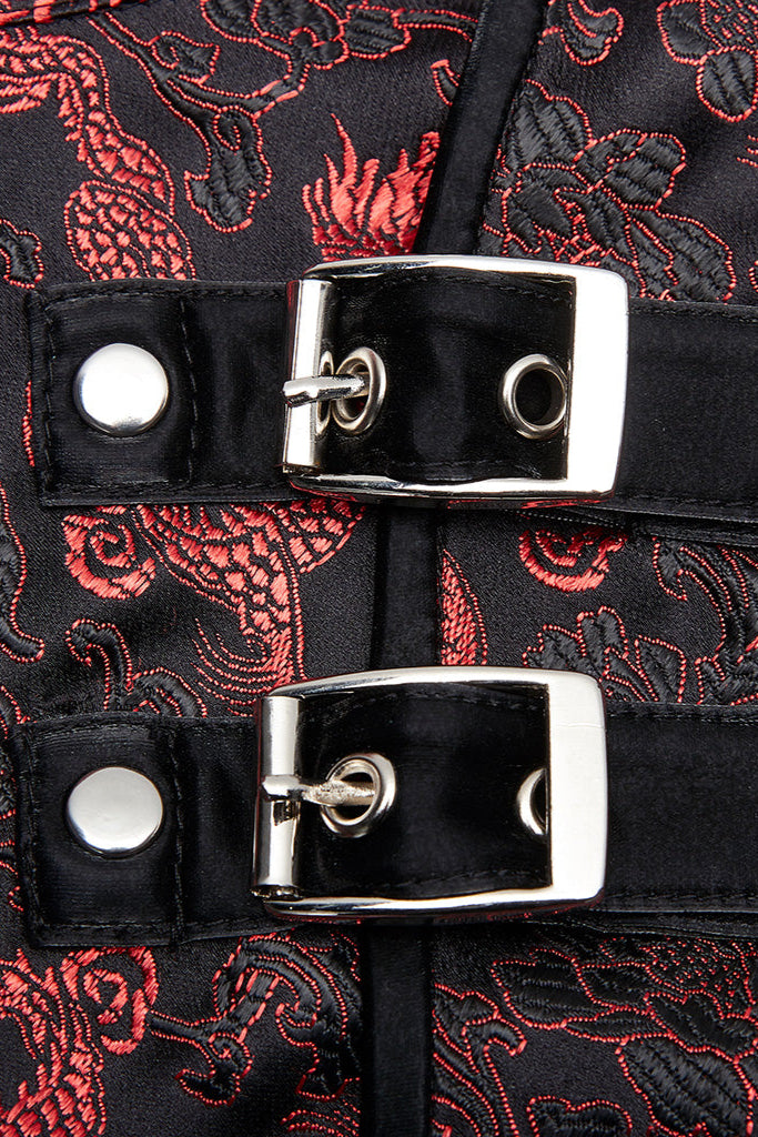 Close-up of metal buckle straps on red dragon brocade cyberpunk mini dress