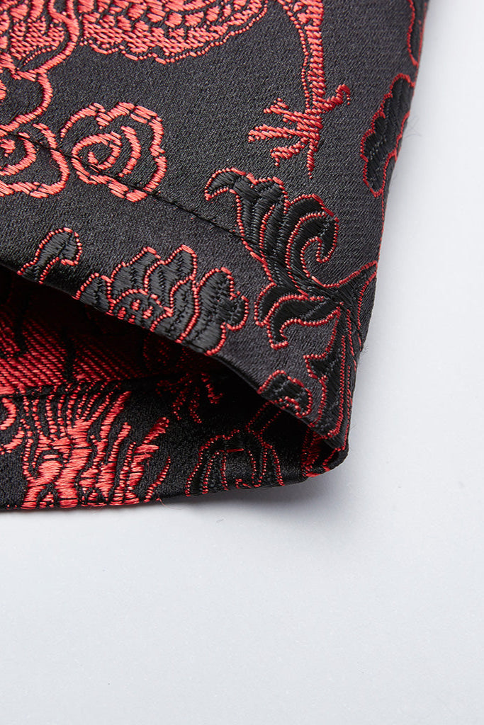 Close-up of red dragon brocade fabric showing texture and embroidery detail on cyberpunk mini dress