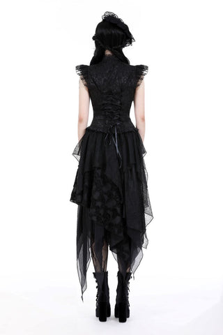 Back view of black asymmetric skirt on model showing flow and length