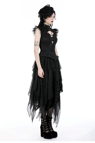 Side profile of layered black skirt worn by model in gothic outfit