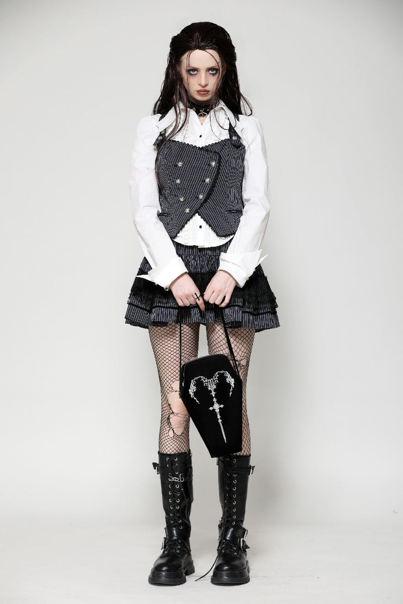 Model wearing Gothic outfit styled with Ritual Mourning Bag held by hand, featuring black boots, pinstripe vest, and fishnet stockings