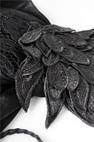 Close-up of embroidered feather appliqué on sleeve of DW380