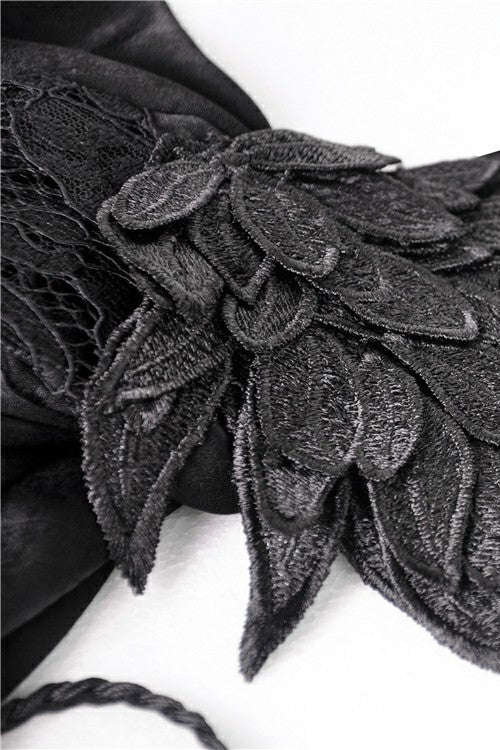 Close-up of embroidered feather appliqué on sleeve of DW380