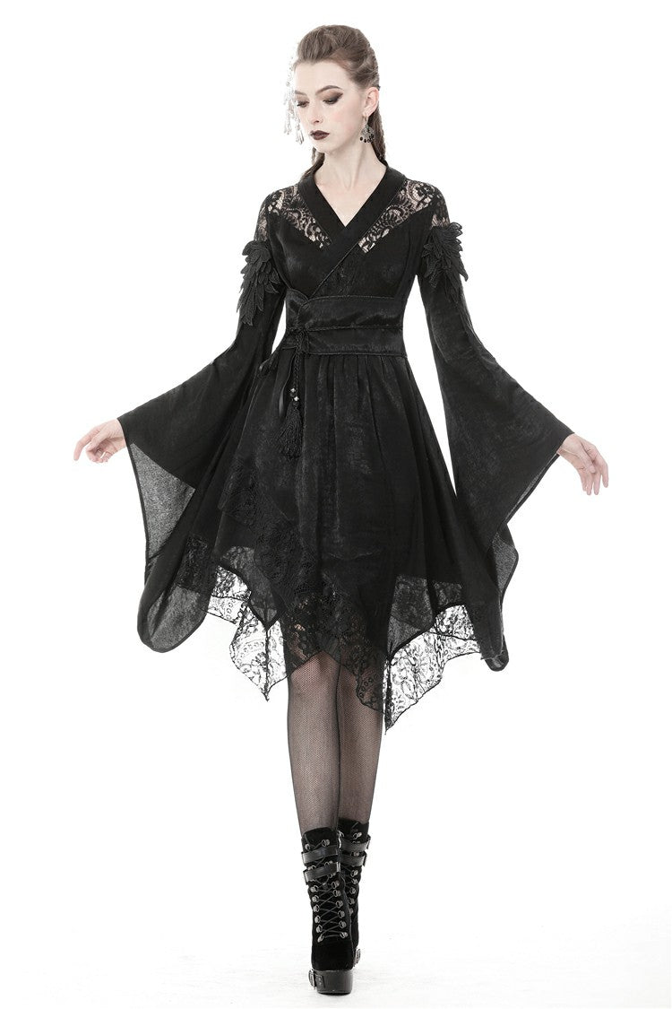 Side view of DW380 dress showing dramatic bell sleeves and lace trim