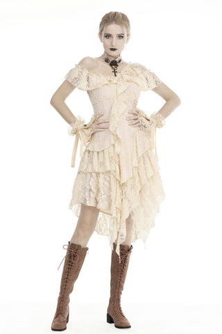 Woman wearing a white lace dress with brown knee-high boots on a white background