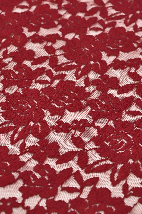 Close-up of red floral lace fabric from Dark in Love DW757 Blood Rose Ballgown – rose motif mesh overlay