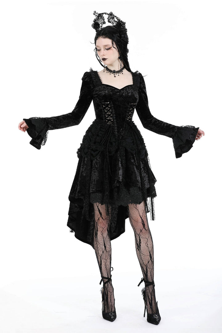 Model wearing a black Gothic high-low dress with flared sleeves, sweetheart neckline, and corset-style bodice.
