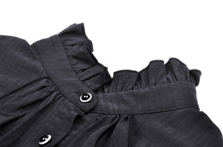 Close-up of the Eleanor black Gothic blouse showing ruffled neckline and decorative buttons on a white background