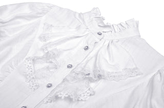 Close-up of white Victorian-style blouse with ruffled high collar, lace trim, and pearl-style buttons – laid flat on white background.