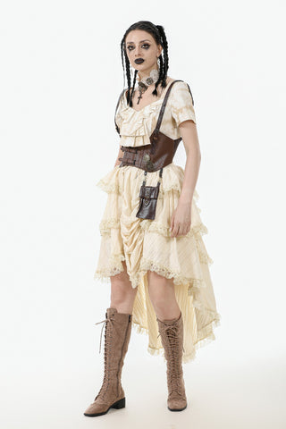 Woman wearing an ivory-white ruffled Steampunk skirt with lace trim, corset belt, and brown lace-up boots, styled against a white background.