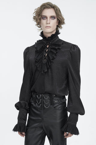 Male model wearing a black Victorian-style poet shirt with ruffled lace-up neckline and bishop sleeves, paired with black leather pants, against a white background.
