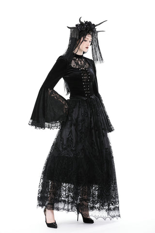 Side view of the blouse styled with a sheer black lace skirt and elaborate veil headpiece, worn by a model against a white background.