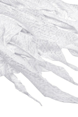 Close-up of handkerchief hem and layered lace on white Gothic dress