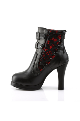 Inner side view of Demonia Crypto-51 ankle boot with red lace underlay, black crisscross lacing, and high heel with buckle strap accents