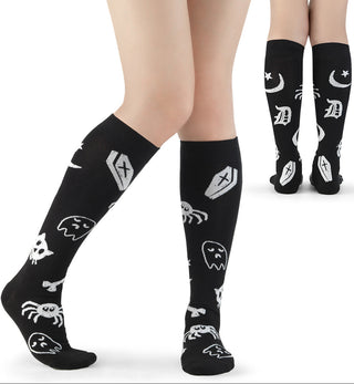 Black and white knee-high socks with spooky skull and bone graphics.