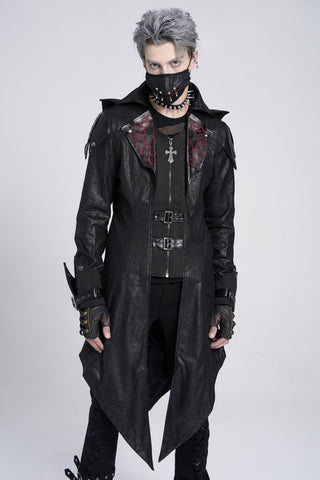 Model wearing Devil Fashion CT06901 men’s long black jacket with red scroll lapels, faux leather panels, buckles, and removable spiked hood, styled in gothic punk fashion against a white background.