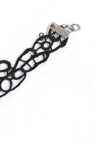Close-up of the lace choker’s metal clasp and extender chain on a white background.