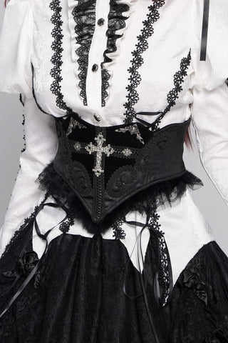 Black Gothic waist cincher with silver cross detail, velvet accents and lace trim worn over a white Victorian blouse.