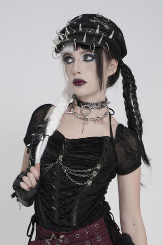 Black faux leather punk military cap with spikes, safety pins and ring hardware worn in gothic style