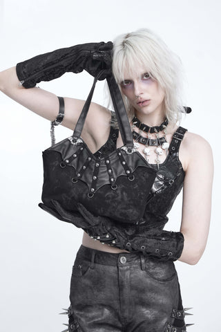 Model holding the Devil Fashion AS310 black twill handbag with studded faux-leather bat wings and silver-tone bat embellishments.