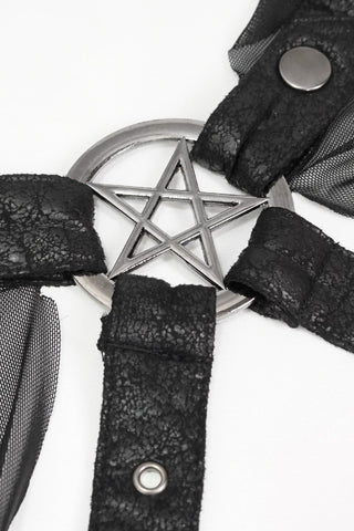 Close-up of a distressed faux leather Gothic harness with sheer mesh straps attached to a silver pentagram ring, displayed against a white background.