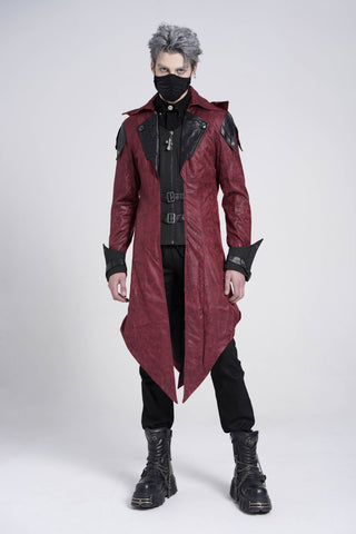 Model wearing Devil Fashion CT06902 men’s long red hooded jacket with black faux leather panels, buckled straps, and gothic punk Assassin’s Creed cosplay styling against a white background.