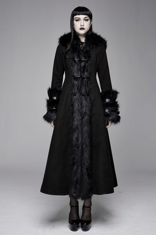 Model wearing a long black Gothic coat with a flared silhouette, faux fur trim along the front and collar, and layered faux fur cuffs.