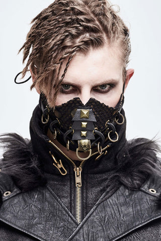 Model wearing a Devil Fashion mk044 black muzzle-style mask with brass hardware and textured faux leather jacket with fur trim.