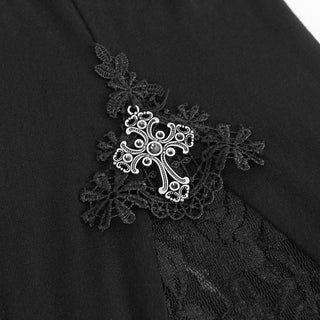 Close-up of Devil Fashion PT050 Gothic pants showing ornate silver cross appliqué with black lace embroidery and sheer lace fabric detail.