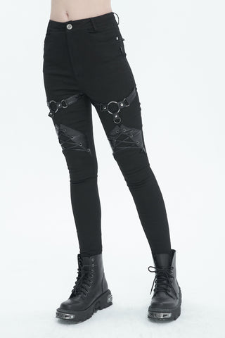 Devil Fashion PT214 black skinny pants with faux leather harness straps and metal O-ring details, styled with combat boots on white background