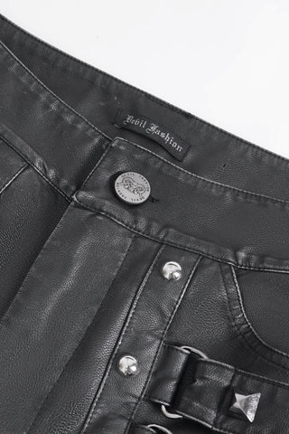 Close-up of Devil Fashion PT24401 pants showing metal button, brand label, and pyramid stud detailing