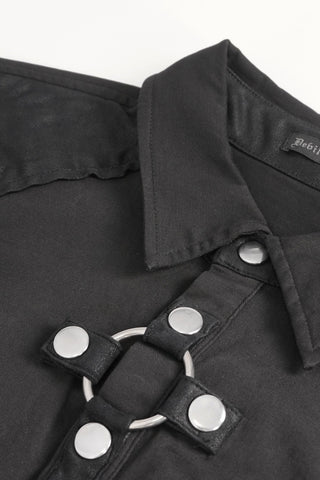 Close-up of a black Gothic shirt collar with silver snap buttons and a metal ring detail on faux leather trim.