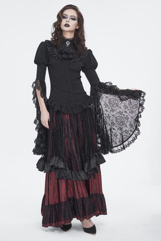 Model wearing a Devil Fashion sht113 Gothic Victorian black lace blouse with ruffled neckline and flowing bell sleeves, paired with a red layered floor-length skirt, on white background.